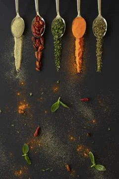 Spoons with spices Stock Photos