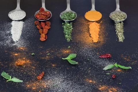 Spoons with spices Stock Photos