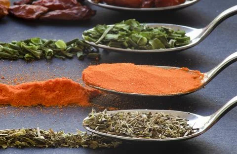 Spoons with spices Stock Photos