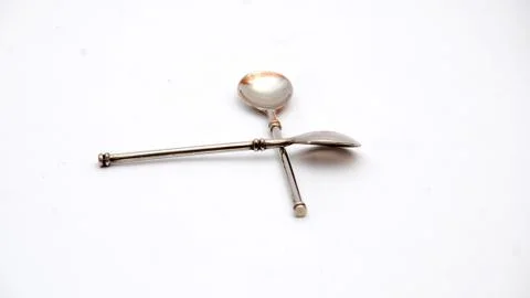 Spoons stacked up to cross shape Stockfoto's