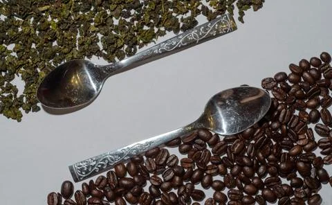 Spoons, tea and coffee beans, white background Stock Photos
