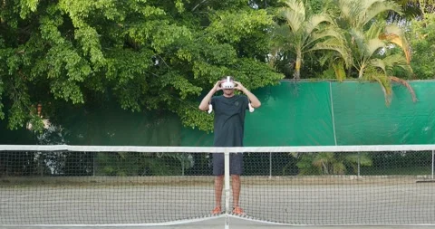 Sport in augmented virtual reality, play VR tennis outdoor. 動画素材 269976882
