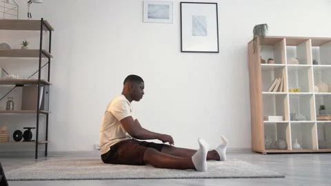 Sport beginner tired black man online home fitness Stock Footage 157496859