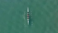 Sport Canoe With A Team Of Four People Rowing On Tranquil Water. Stock Footage