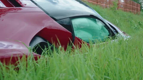 Sport car with deployed airbag inside the road ditch after control loss 動画素材 345438833