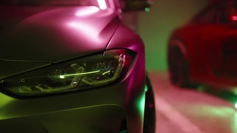 Sport car front headlight in an underground garage Stock Footage 343549441