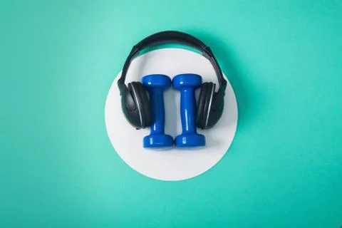 Sport flat lay composition with dumbbells and headphones Stock Photos