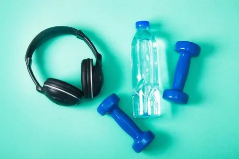 Sport flat lay composition with dumbbells and headphones Stock Photos