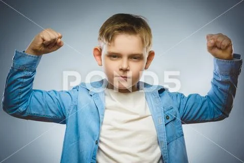 Sport Handsome Boy. Strong serious kid showing his hand biceps muscles Stock Photos