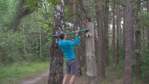 Sport man doing pull-ups on horizontal bar Stock Footage 116824805