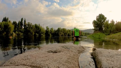 SPORT MAN IN THE MIDDLE OF THE RIVER Stock Footage 91780258