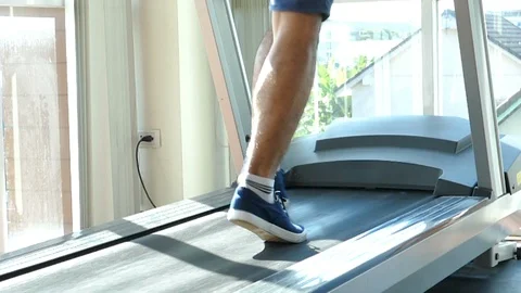 Sport man running on a Treadmill Stock Footage 89812132