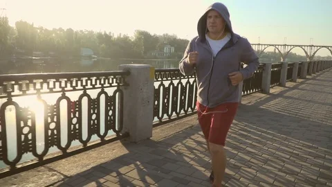 Sport runners jogging on river side at dawn Stock-Footage 79136689