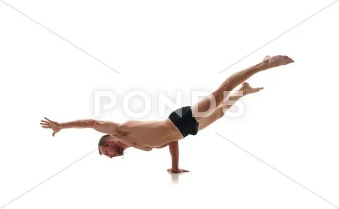 Sport. Studio photo of athlete doing handstand Stock Photos