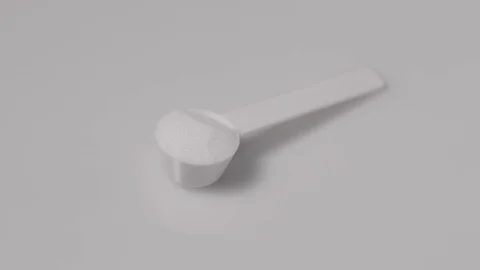 Sport supplement, creatine, hmb, bcaa, amino acid or vitamin scoop with powder. Stock Footage 77728059