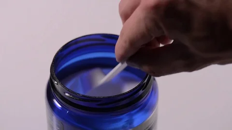 Sport supplement, creatine, hmb, bcaa, amino acid or vitamin scoop with powder. Stock Footage 77728079