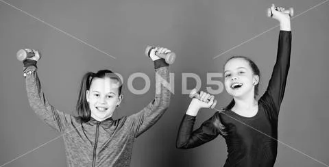 Sport for teens. Easy exercises with dumbbell. Sporty upbringing. On way to Stock Photos