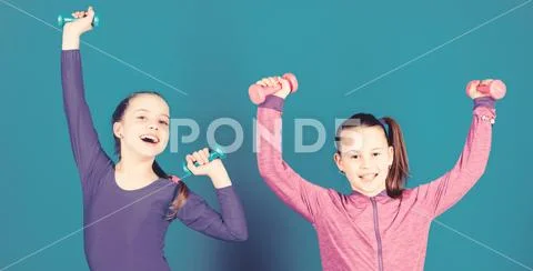 Sport for teens. Easy exercises with dumbbell. Sporty upbringing. On way to Stock Photos