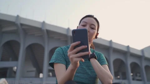 Sport woman using mobile smart phone tracking activity. Stock Footage 157979953