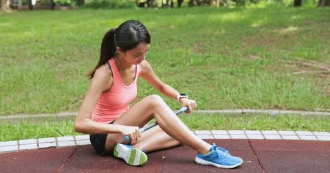 Sport woman using roller stick in the park Stock Footage