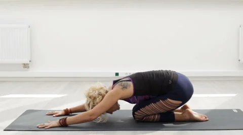 Sporting woman doing yoga exercise on the mat Stock-Footage 66476356