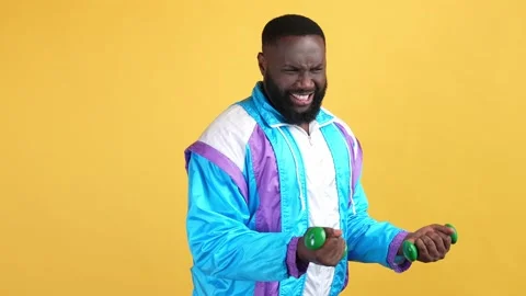 Sportive guy try train up heavy dumbbells isolated bright color background Stock Footage 167657147