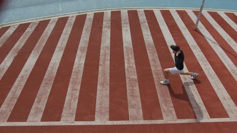 Sportive man doing lunges Stock Footage 100029584