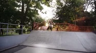 Sportive Man Practicing Parkour In The Open Skate Park - Sliding From The Ramp Stock Footage