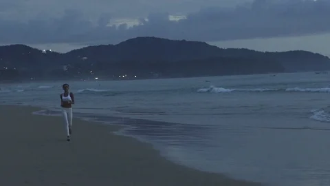 Sportive Runner Running On The Beach At Sunset Stock Footage 70985986