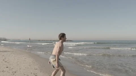 Sportman on the beach Stock Footage 58253082