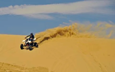 Sportquad in sand Stock Photos
