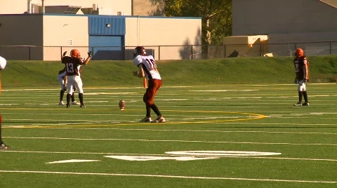Sports and fitness, high school football, #9 huddle huge kickoff fumble Stock Footage