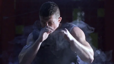 Sports and people, young male athlete training in boxing gym Stock Footage