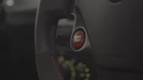 Sports car push to start steering wheel engine startup Stock Footage 90601989