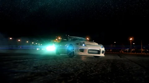 drift car drifting around a tire stack 4k night time