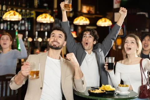 Sports fans react with delight to changes in lucky game Stock Photos