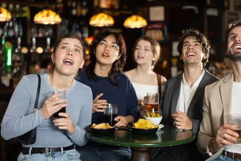 Sports fans react with delight to changes in lucky game Stock Photos
