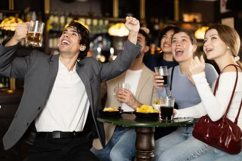 Sports fans react with delight to changes in lucky game Stock Photos