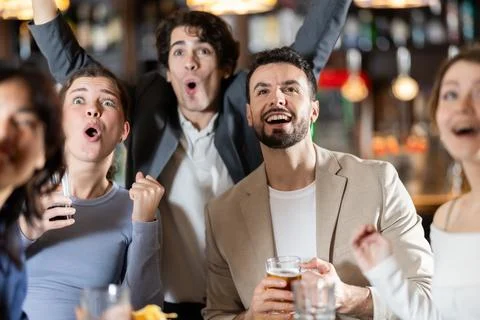 Sports fans react with delight to changes in lucky game Stock Photos