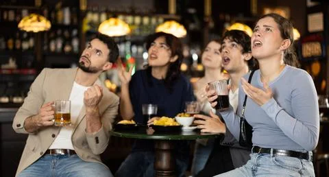 Sports fans react with disappointment to changes in bad luck game Stock Photos