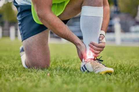 Sports, foot pain and man with injury on field after practice match, training Stock Photos