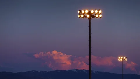Sports Lights at Sunset Time Lapse with Len Flare - Shallow Depth of Field Stock-Footage 106914209