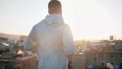 Sports man preparing or warming and jumping on training workout on city rooftop Stock Footage 101138539