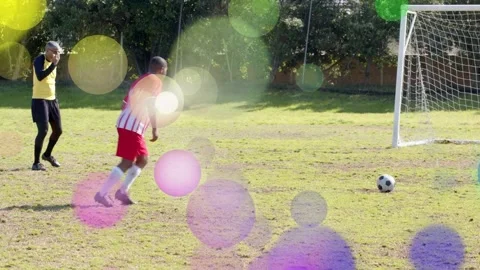 Sports ref stepping back kicker striking ball trying to score at goal keeper Stock Footage 333936596