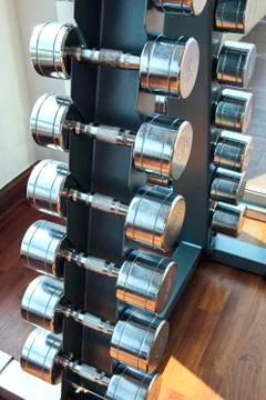 Sports weight  dumbbells set  in healthy care fitness room Stock Photos