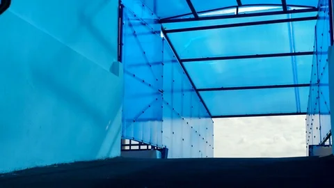 Sportsman with a bionic leg is walking with a backpack Stock Footage 116802417