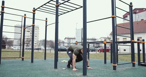 Sportsman doing burpee exercise  Stock Footage 145348083