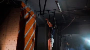 Sportsman doing an exercise on a horizontal bar in the gym Stock Footage 86080410