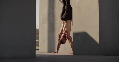 Sportsman doing handstand push ups Stock Footage 201460981