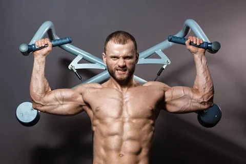 Sportsman doing pulling-up Stock Photos
